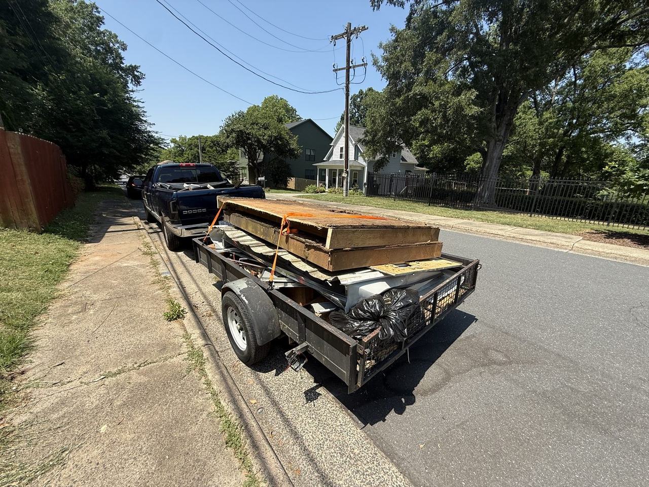 Mount N Muscle trailer loaded with hauled debris in Charlotte NC